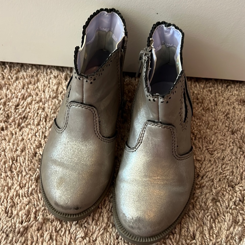 Cowboy type silver boots.